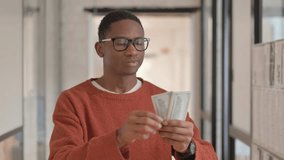 Portrait of Happy African Man Counting Money - Powered by Shutterstock - Get 15% off with code: PIKWIZARD15