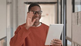 Portrait of African Man Doing Video Chat on Tablet - Powered by Shutterstock - Get 15% off with code: PIKWIZARD15