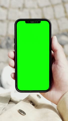 Young Man Phone Look and Busy Walking to Work Close-up. Caucasian Guy Hold in Hand Smart Phone with Screen Mock-up. Urban Life Leisure in Blank Smartphone. Use Cellphone for Footage, App, Copy Space