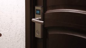 Male hand using plastic electronic contactless card key to open door of hotel room. Wireless technology to unlock doors. Magnetic smart lock, protection and security system concept - Powered by Shutterstock - Get 15% off with code: PIKWIZARD15