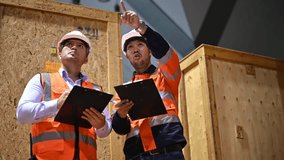 Warehouse inspectors and factory architects are discussing the expansion of the warehouse to store more goods to meet customer demand. - Powered by Shutterstock - Get 15% off with code: PIKWIZARD15