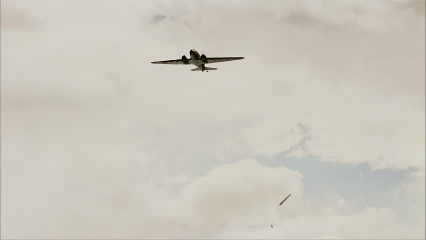 Aircraft Flying In The Sky, Paratroopers Jump Out Of It Video