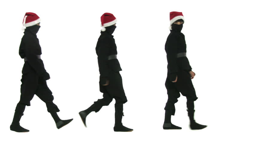 Seven young ninja assassins in Santa hats walk through the shot. Ho Ho Ho! It's