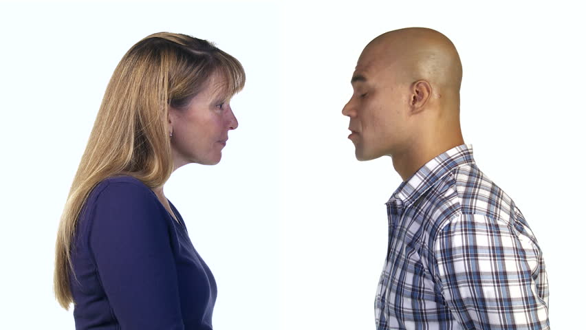 Man and woman nod their heads, showing agreement with each other. Profile shot.