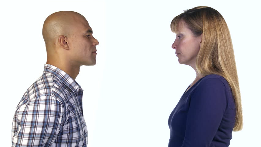 Man uses positive gestures to try to persuade woman, but she shakes her head and
