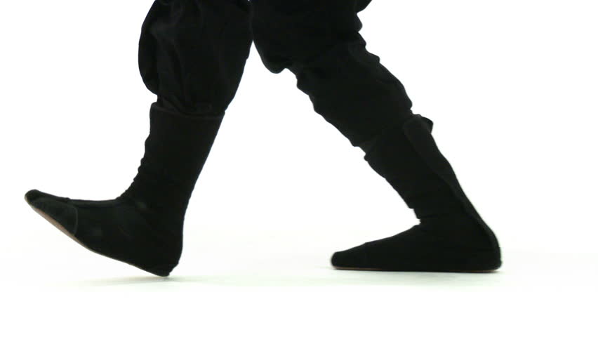 Panning camera follows ninja feet as they walk on a white background.