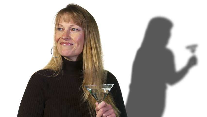 Woman drinks a martini and her shadow seems to get wilder.
