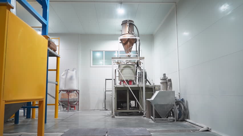 Packing machine equipment for plastic materials processing in workshop. Polyester and microplastic commodity preparation machinery in industrial facility