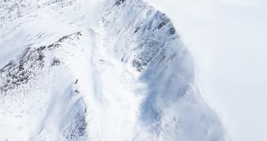Aerial view of Snow mountain of Jiajinshan in Sichuan China with clouds and mist, amazing nature landscape