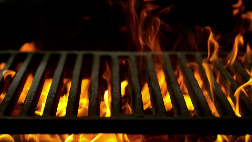 Super Slow Motion Close-Up of Hot Grill Grate with Flames and Glowing Embers at 1000fps.