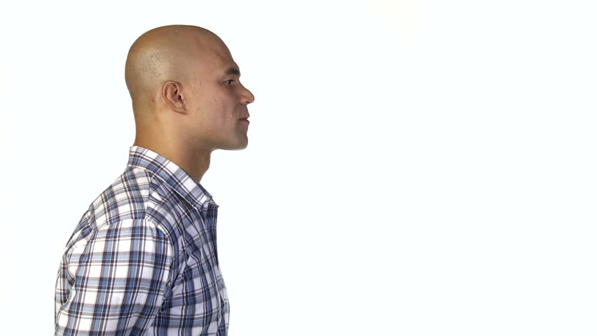 Man nods his head and shows he agrees with what's being said or presented to