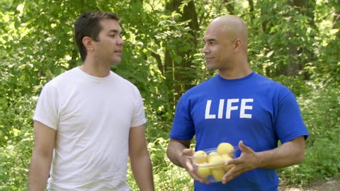 Life gives a man lemons on a hot day. They magically (jump cut) turn into a jug of lemonade which he pours over himself. Partial slow motion, recorded at 60fps. Stockvideo