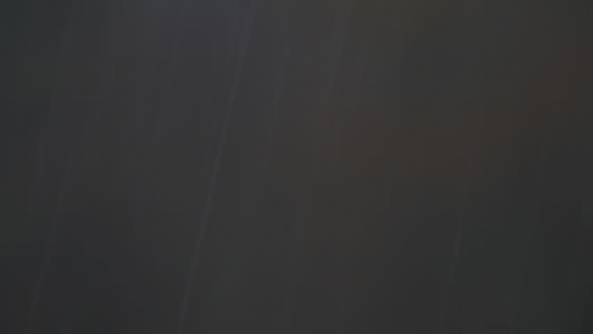 Rain in the distance filmed with a telephoto lens
