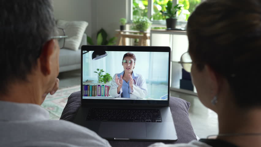 Senior couple have video call with doctor use wireless internet connection on laptop, Senior patient talk consult with physician online on webcam conference on computer - Powered by Shutterstock - Get 15% off with code: PIKWIZARD15
