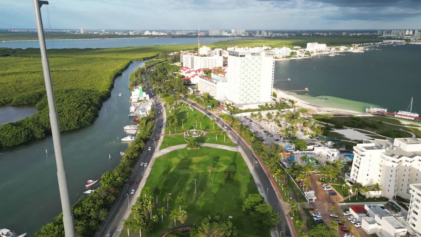 Cancun’s hotel zone near playa langosta, showing lagoon, beach, and resorts, aerial view