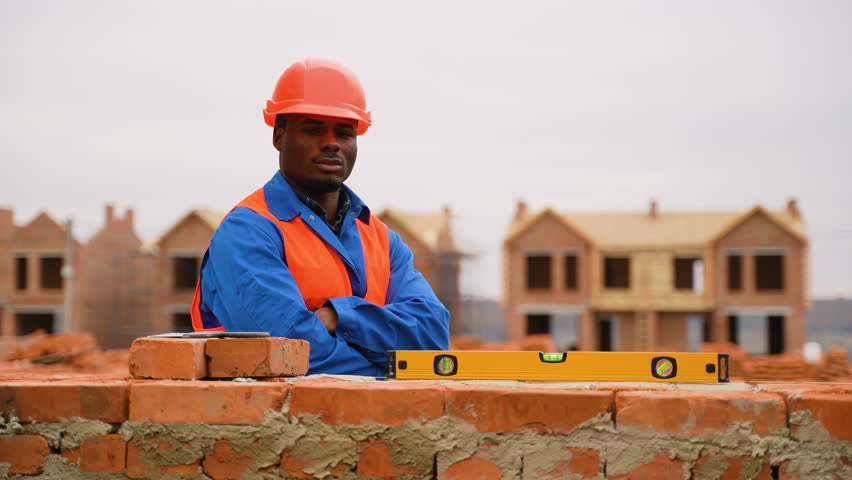 African American construction worker at townhouse building site