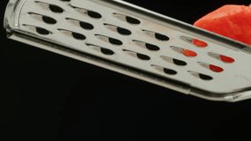 Carrot macro, Woman hands with a grater grate carrots on the wooden board, chef cooking polish potato pancakes in the kitchen. Healthy eating and lifestyle.  - Powered by Shutterstock - Get 15% off with code: PIKWIZARD15