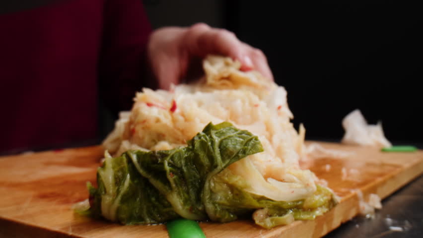 Close-up of texture fermented spicy cabbage kimchi with in can. Preservation of vegetables in glass jars. Fermentation preserved kimchi cabbage with spices macro. Asian cuisine.