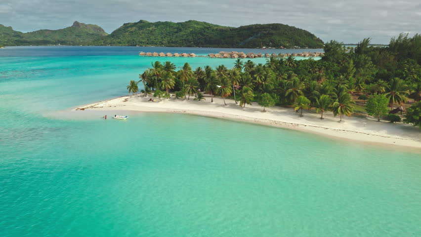 Multiple aerial views show a tropical island resort in Bora Bora with overwater bungalows, palm trees, white sand beaches, and stunning turquoise waters
