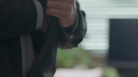 Hand discreetly pulling a USB stick from a jacket pocket and handing it to another person. Data transfer, hacking, confidential exchanges. cybersecurity, corporate leaks, intelligence operations. - Powered by Shutterstock - Get 15% off with code: PIKWIZARD15