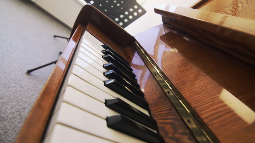 Smooth black and white keys of piano keyboard exude timeless beauty closeup. Vintage musical instrument ready to bring music classroom to life