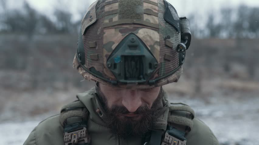 Face of a soldier in ammunition close-up
