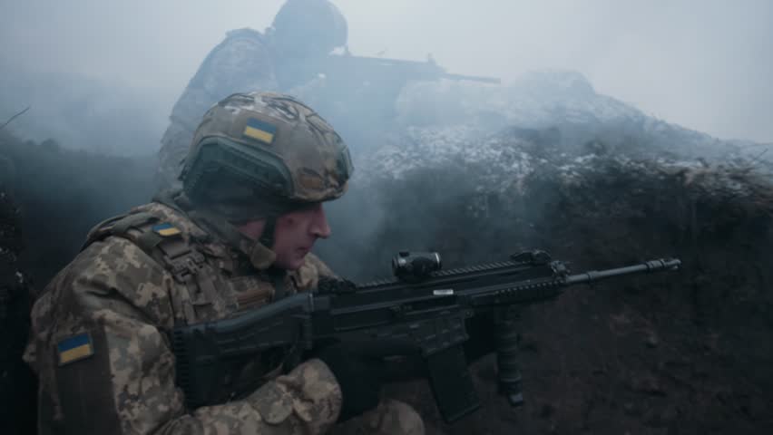 Soldiers shooting in the trenches