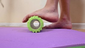A foot rolling on a massage roller for fitness, demonstrating muscle recovery, self-massage, and relaxation. Perfect for therapy and rehabilitation exercises. - Powered by Shutterstock - Get 15% off with code: PIKWIZARD15