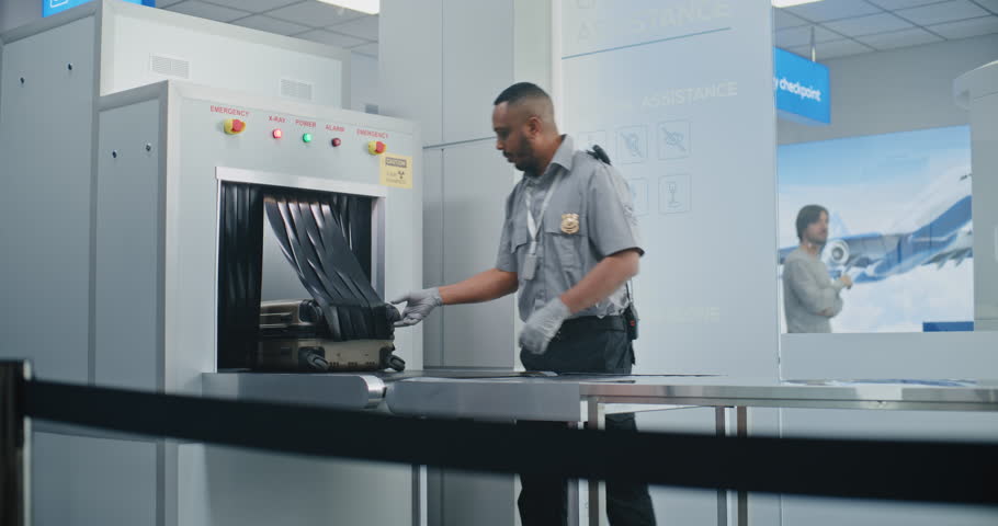 Security Checkpoint in Airport Terminal: Airport Staff Conducting TSA Screening. Female Security Officer Inspects Young Girl, African American Worker Scanning Suitcase in Metal Detector Conveyor Belt.