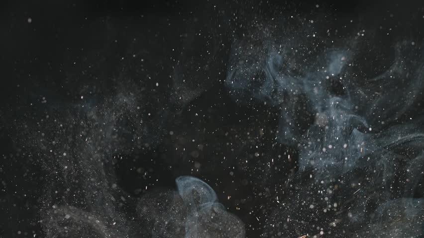 Splashes and smoke from cooking on black background. Cinematic advertising video. Cooking in kitchen. Suitable for videos about any food during frying. Professional quality video