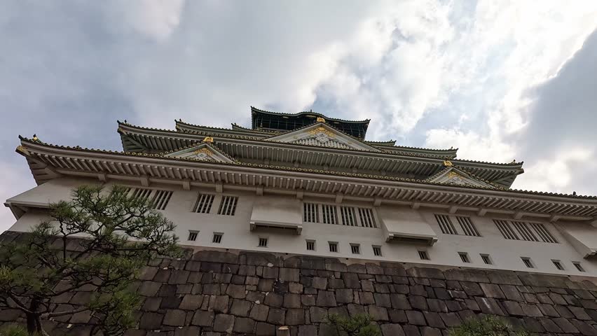 Wide angle close up of Osaka Castle. Looking up the walls of this Samurai architecure