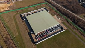 Aerial view drone perspective of large data centre in England Quantum computing data storage future technology. The expansive structure exemplifies the integration of cutting-edge technology. - Powered by Shutterstock - Get 15% off with code: PIKWIZARD15
