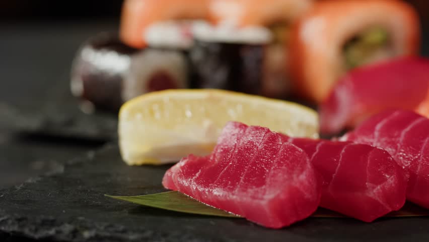 Sushi Sashimi Nigiri Platter, japanese gunkan maki sushi restaurant, Fresh Tuna and Salmon Slices in modern cafe, traditional food, raw red fish dish, omega 3.