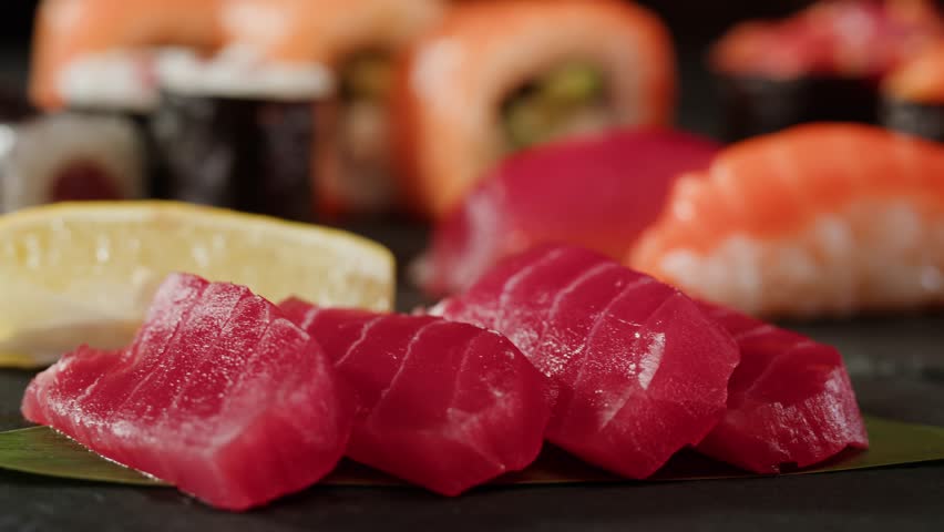 Sushi Sashimi Nigiri Platter, japanese gunkan maki sushi restaurant, Fresh Tuna and Salmon Slices in modern cafe, traditional food, raw red fish dish, omega 3.