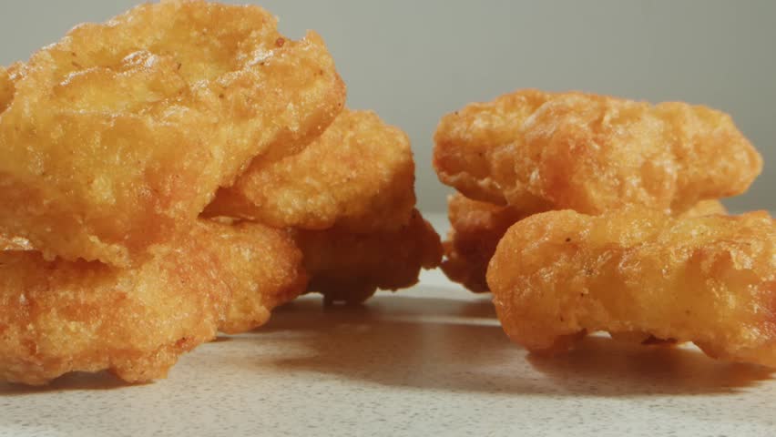 Fast food delivery meals chicken nuggets and fried chicken fish and chips ready to takeaway. Fat American cuisine macro close up restaurant..