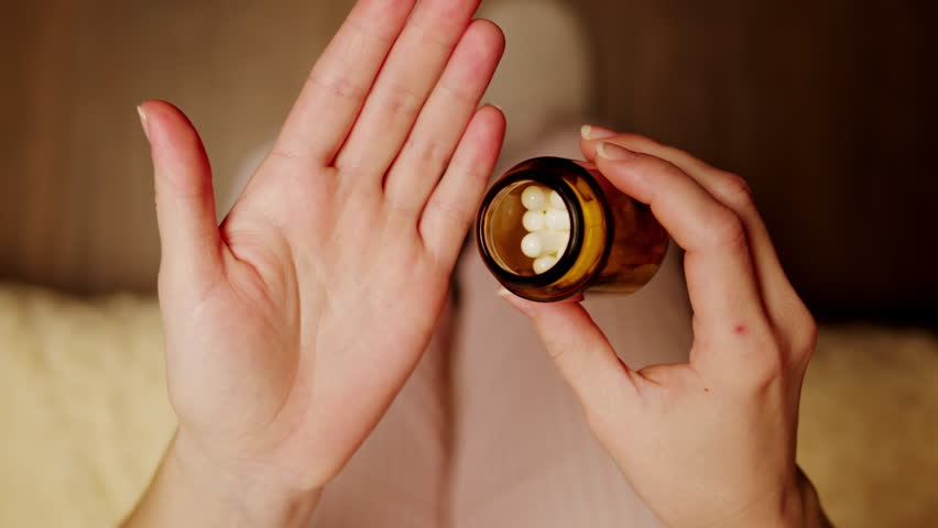 Pills and vitamins macro, Close up view of womans hands holding plenty of different drugs. Painkillers and antibiotics. Healthcare and medicine concept