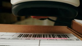 Scanner scan delivery box in storage, E-commerce shop, man packing goods and clothes second hand delivery market, courier Packaging and Shipping Workspace with Supplies and Technology, online sales. - Powered by Shutterstock - Get 15% off with code: PIKWIZARD15