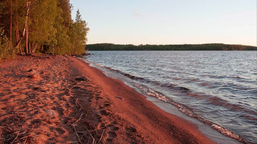 Time-lapse of a summer evening on the shore of a lake in the forests of Finland