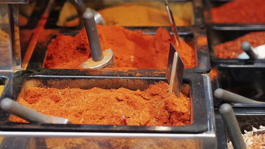 Mix spices dried pink, black pepper, green dill, red paprika, yellow turmeric, garlic, salt close-up macro. A bunch of natural spice for food .Seasonings and condiments concept