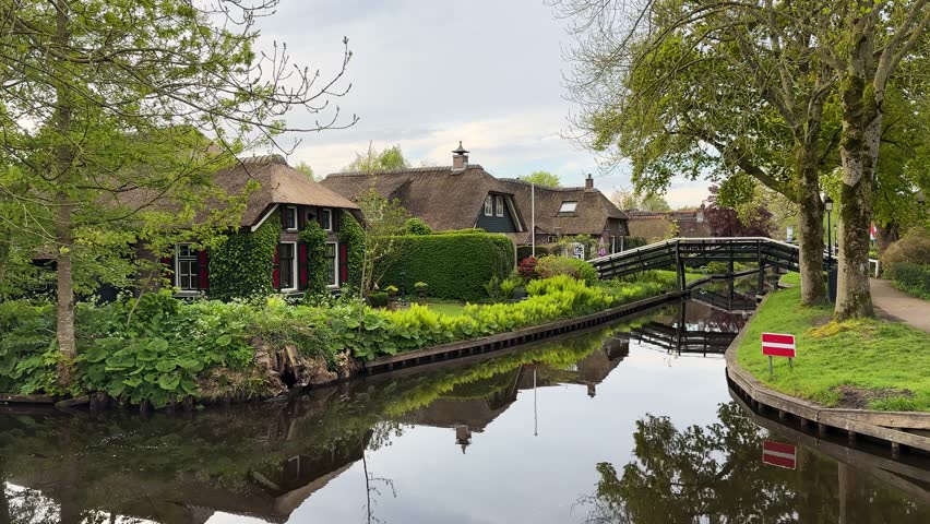 rural dutch traditional country small old town Giethoorn with canals and boats, Netherlands