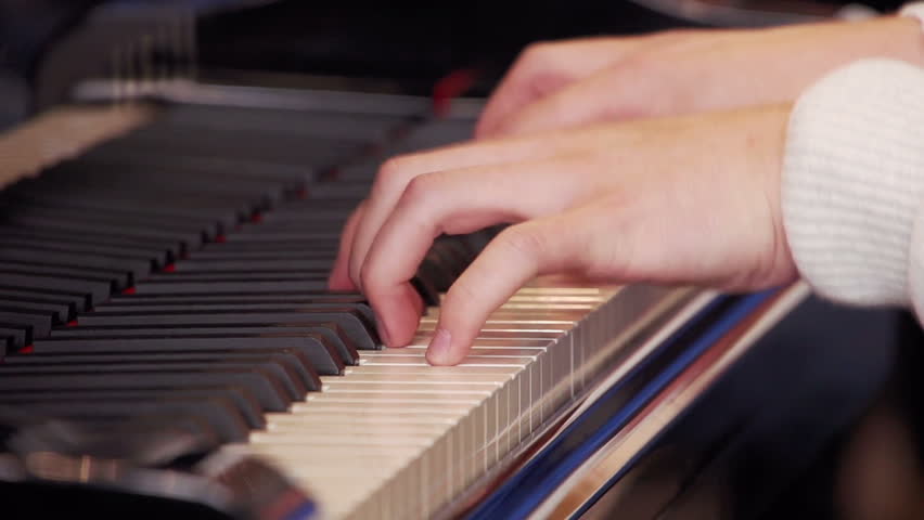 Pianist plays on piano - slow motion