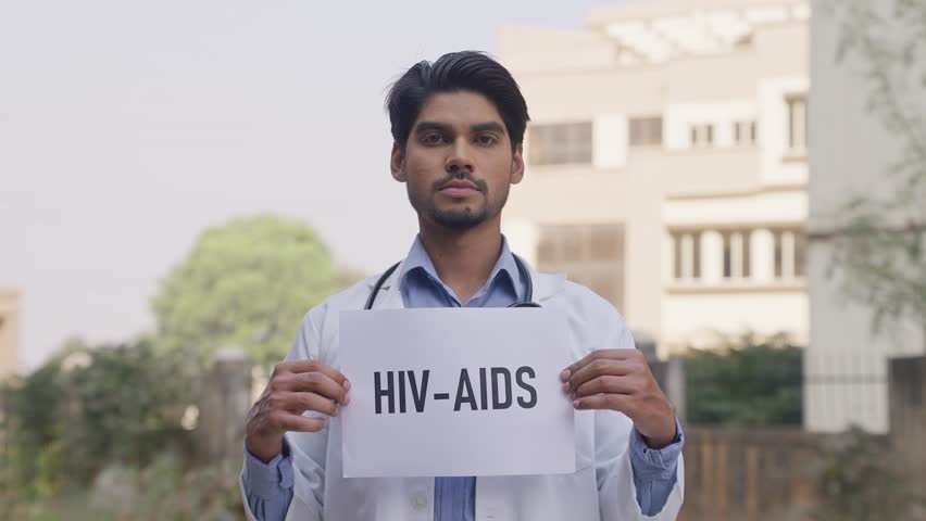 Indian Doctor Holding HIV-AIDS Poster