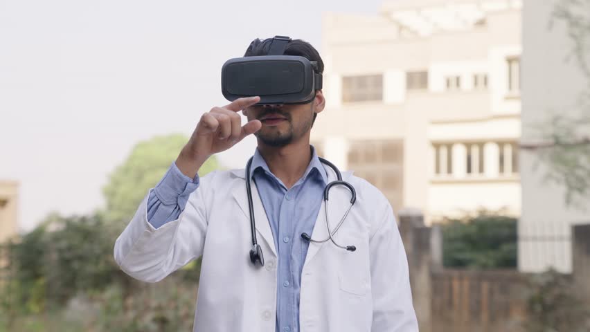 Indian Doctor Working in VR Headset, Virtual Reality - Powered by Shutterstock - Get 15% off with code: PIKWIZARD15