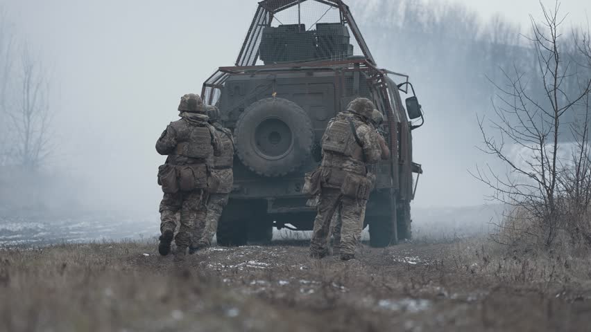 Armored vehicles and infantry move forward