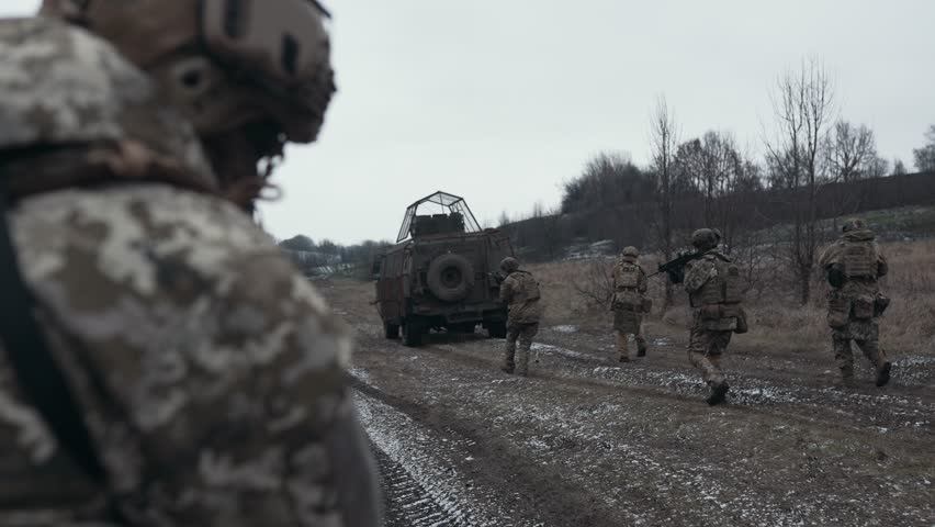 The military is going on an assault under the cover of heavy equipment