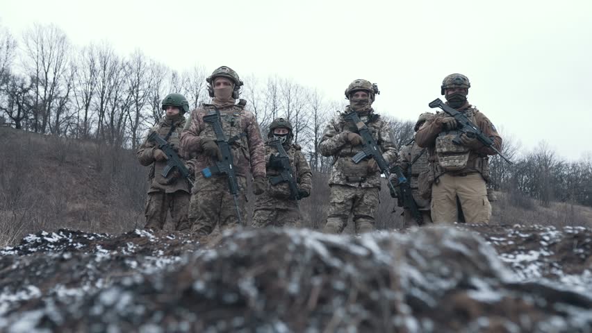 a group of Ukrainian soldiers in full ammunition