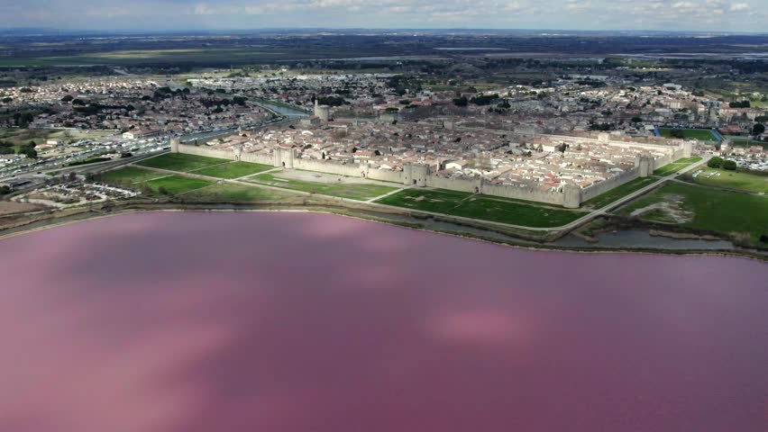Aerial flyover above the medieval village of Aigues Mortes in Le Gard, South France