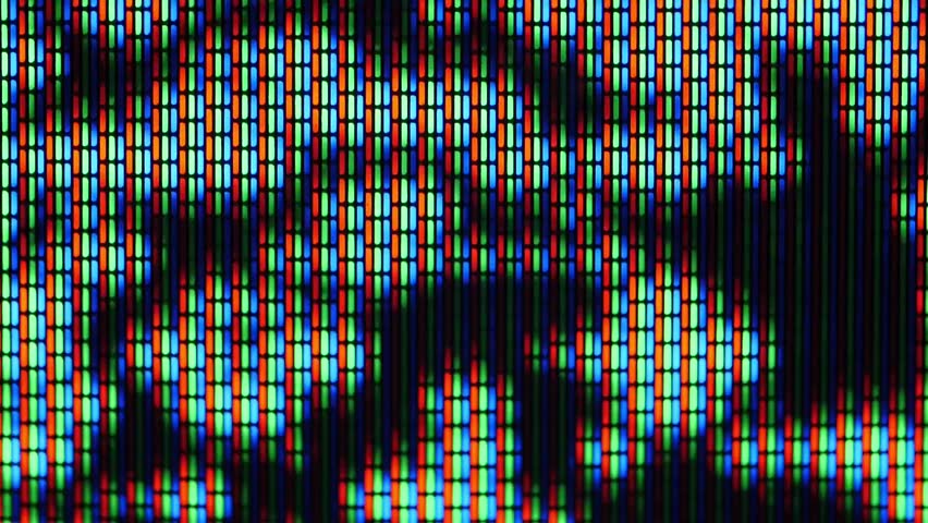 Vivid RGB pixels close up shot on a vintage TV screen.