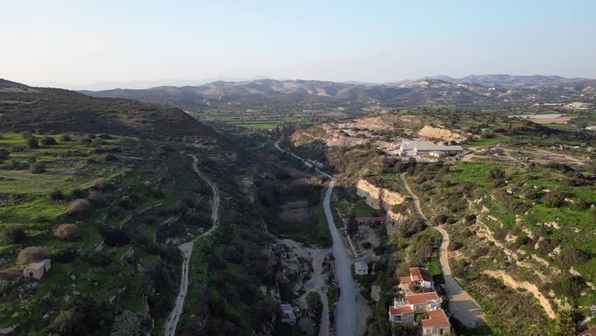 Dynamic 4K drone footage of a highway from Cyprus Old Town. Scenic route, historic outskirts, and sunny Mediterranean views, perfect for travel and tourism