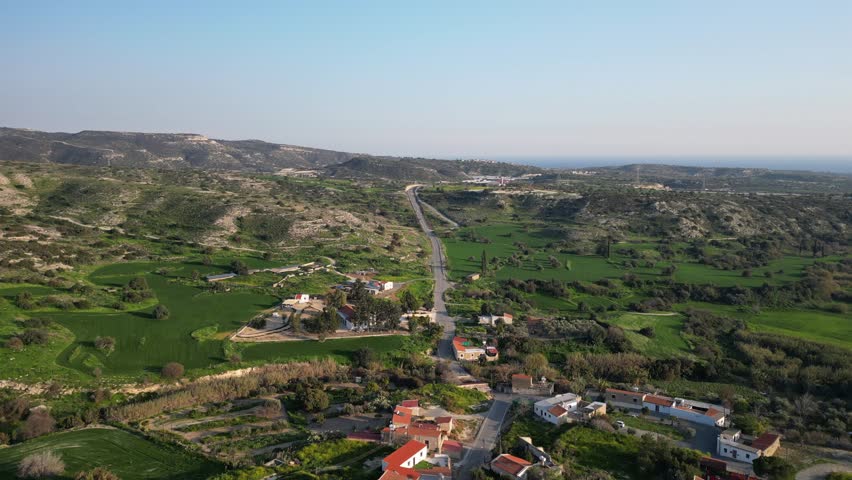 Dynamic 4K drone footage of a highway from Cyprus Old Town. Scenic route, historic outskirts, and sunny Mediterranean views, perfect for travel and tourism